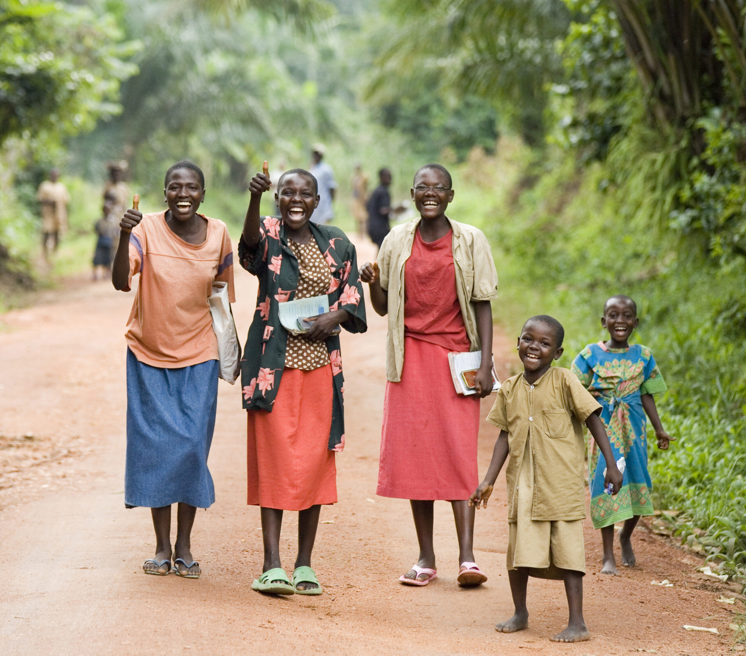 Joyful group walking down a rural path